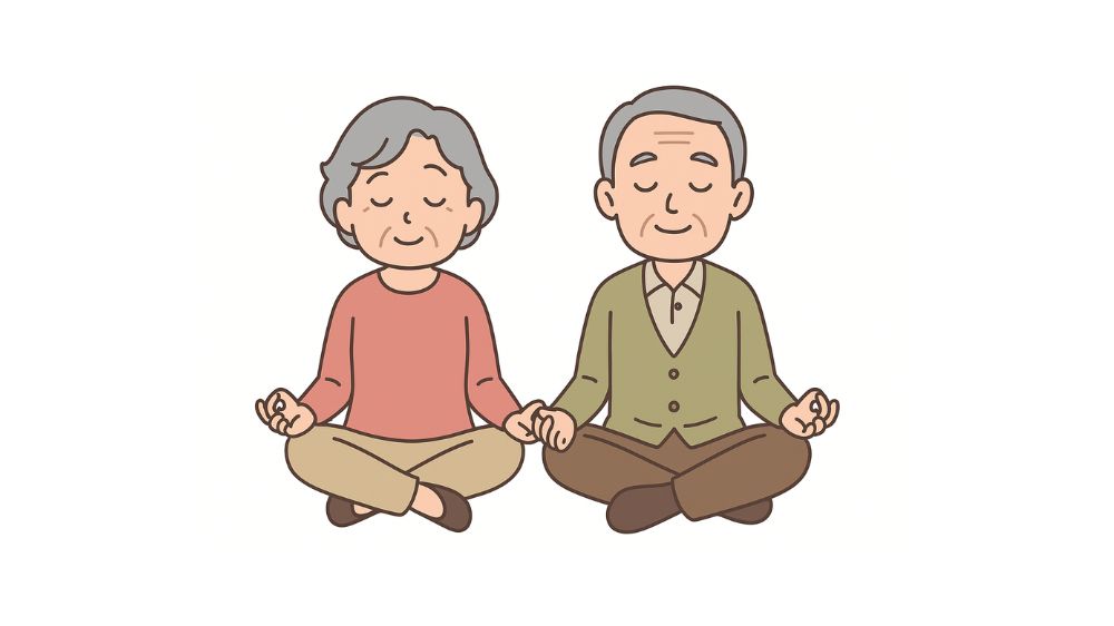 高齢者夫婦が胡座をかき瞑想をしている