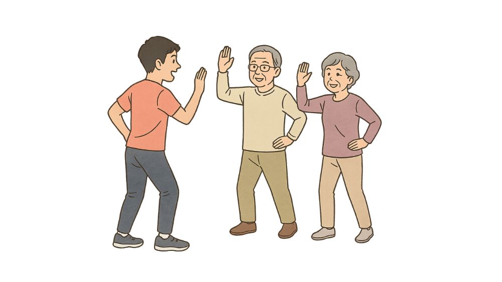 高齢者夫婦に若い男性指導員がダンスの方法を教えている