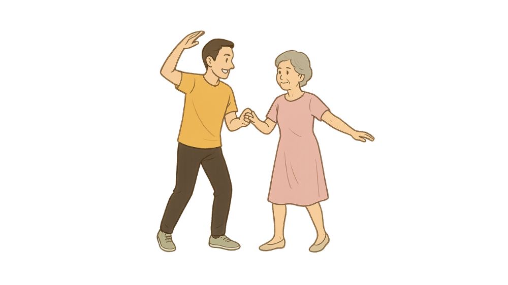 男性指導員と高齢者女性が微笑みながら踊っている