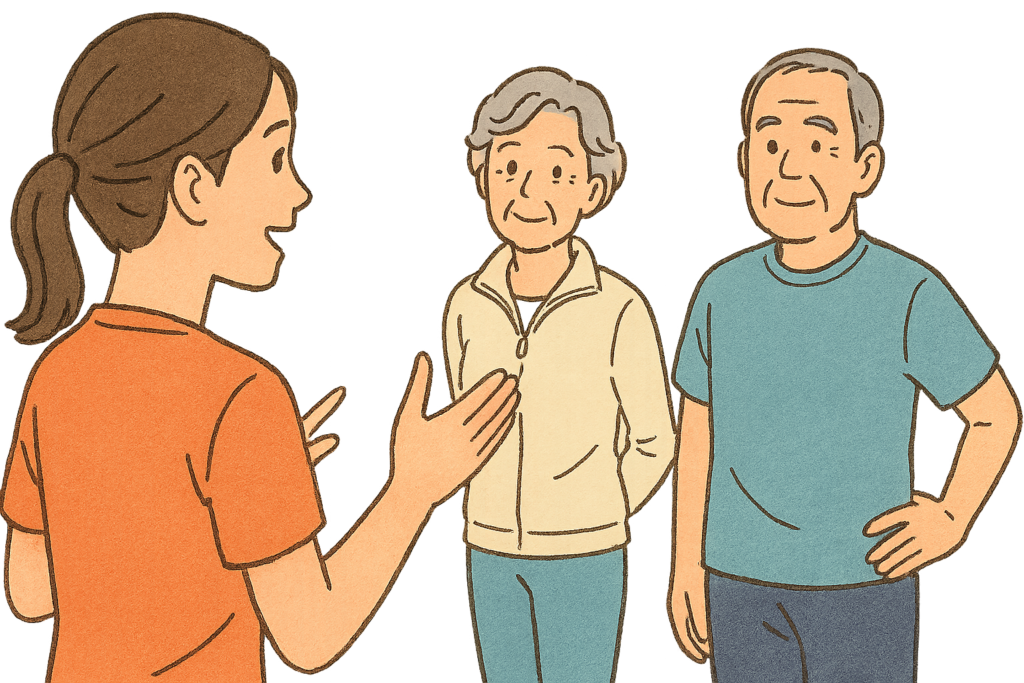 女性講師から高齢者夫婦が講義を受けている