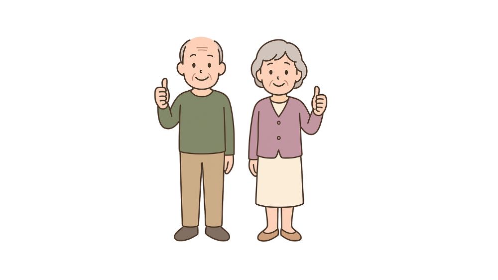 高齢者夫婦が親指を出して微笑んでいる