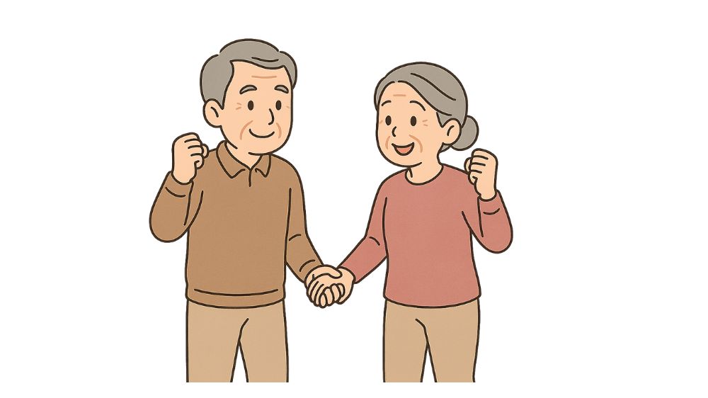 高齢者夫婦がお互いに手を取り合い、微笑んでいる